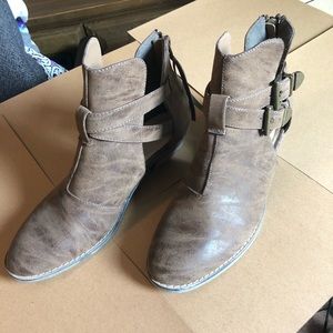 Two-buckle open ankle boots.